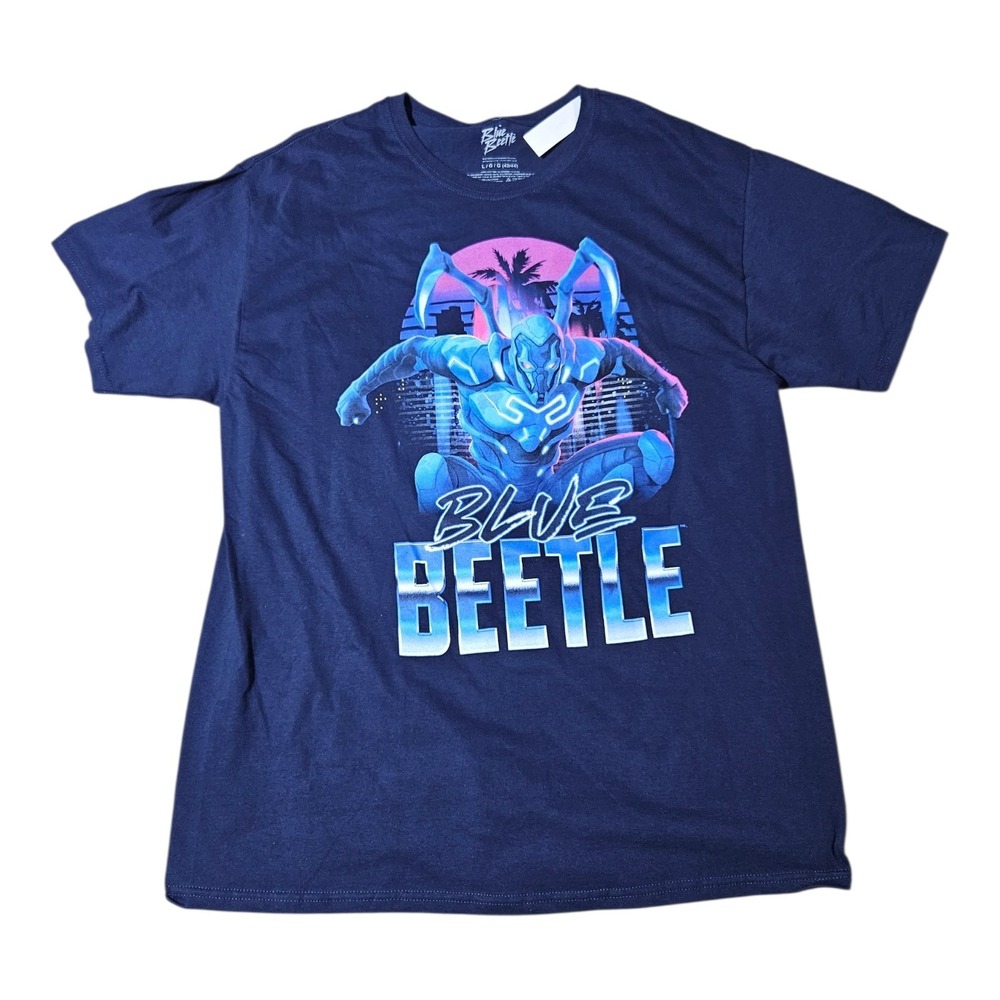 Blue Beetle Adult T-Shirt Crouching In Front of Pink Sunset Beetle City Jump L